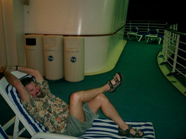 Steve relaxing at night in the back of the ship listening to the calypso band (we found them on the third day.)